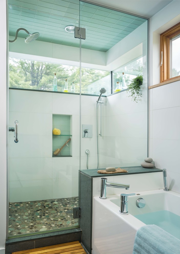 Mid-sized contemporary master bathroom in Other with an alcove shower, white tile, medium hardwood floors, a drop-in tub, white walls, brown floor and a hinged shower door.