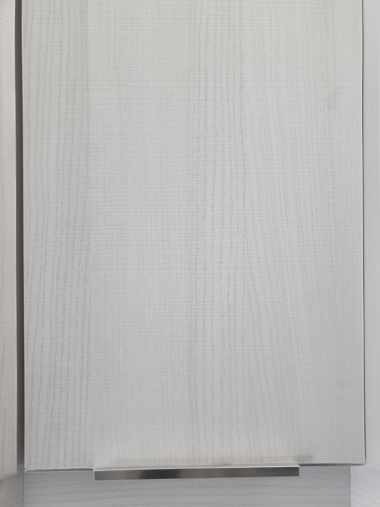Example of a small minimalist u-shaped kitchen pantry design with a single-bowl sink, flat-panel cabinets, white cabinets, granite countertops, white backsplash, subway tile backsplash, stainless steel appliances and gray countertops