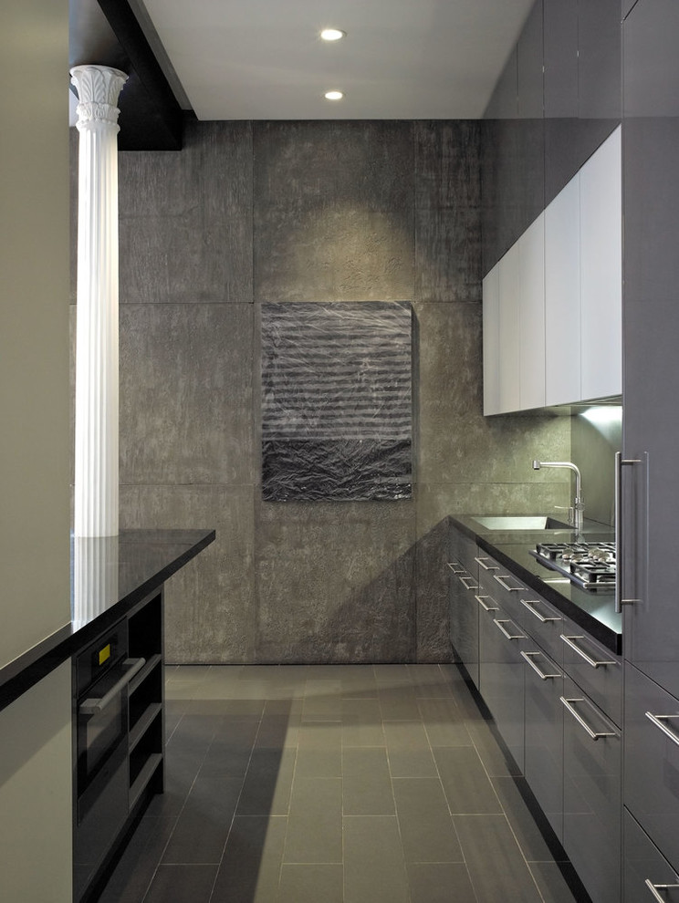 Kitchen - contemporary kitchen idea in Chicago with a single-bowl sink, flat-panel cabinets, gray cabinets, gray backsplash and a peninsula
