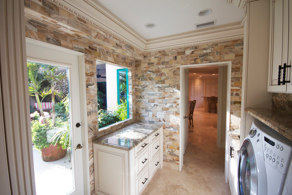 Photo of a mid-sized mediterranean laundry room in Tampa.