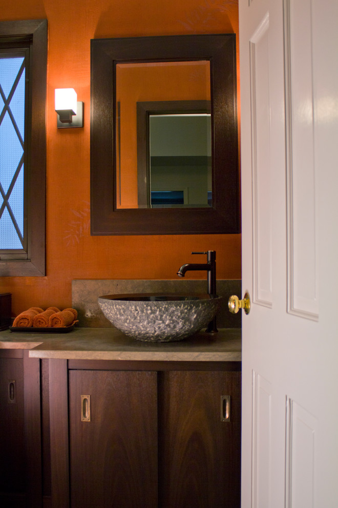 Small asian powder room in Chicago with flat-panel cabinets, dark wood cabinets, red walls and a vessel sink.