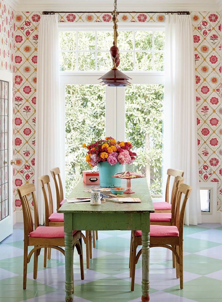 Inspiration for a small beach style dining room in Los Angeles with multi-coloured walls and painted wood floors.
