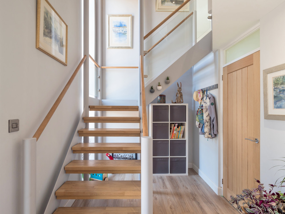 Inspiration for a mid-sized modern hallway in West Midlands with white walls and vinyl floors.