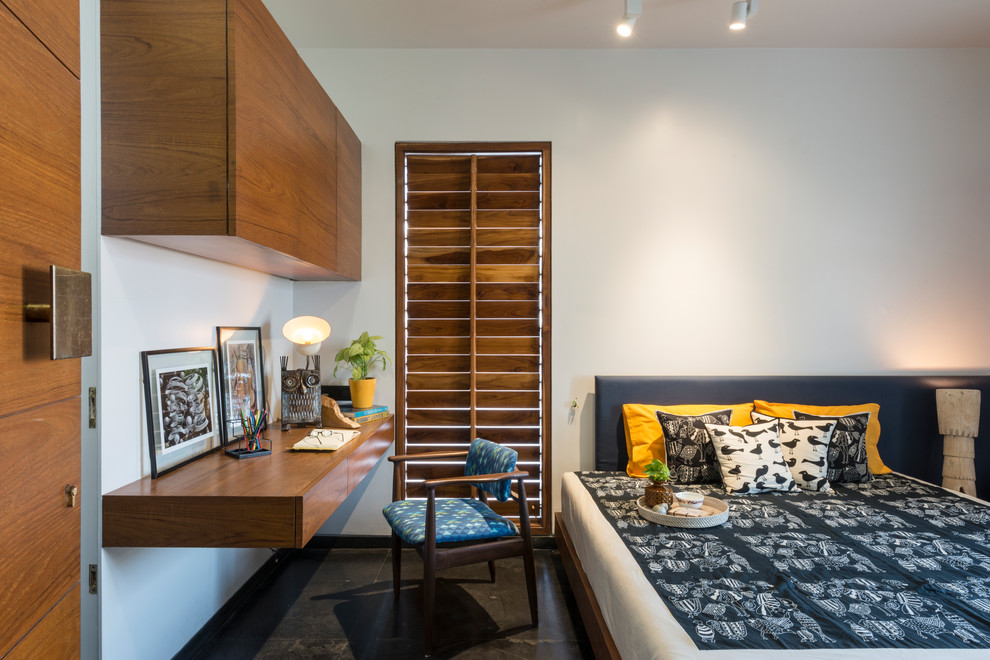 Asian guest bedroom in Other with white walls and black floor.