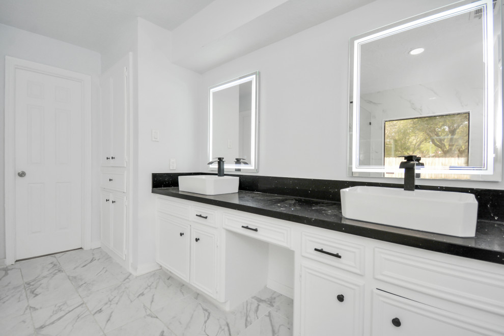 This is an example of a mid-sized modern master bathroom in Houston with beaded inset cabinets, white cabinets, a hot tub, gray tile, porcelain tile, porcelain floors, a vessel sink, engineered quartz benchtops, grey floor, black benchtops, a double vanity and a built-in vanity.
