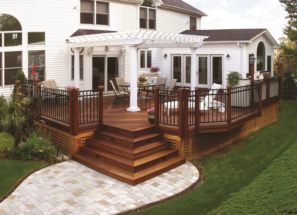 Design ideas for an expansive eclectic backyard deck in Nashville with an outdoor kitchen and a pergola.
