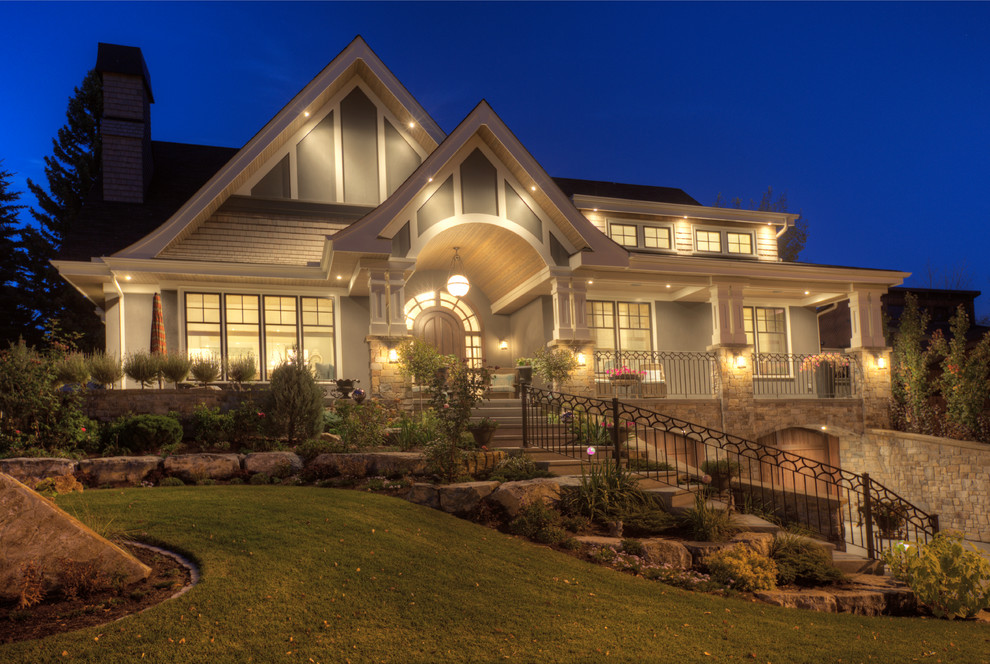 Example of a large transitional blue two-story mixed siding gable roof design in Calgary with a shingle roof