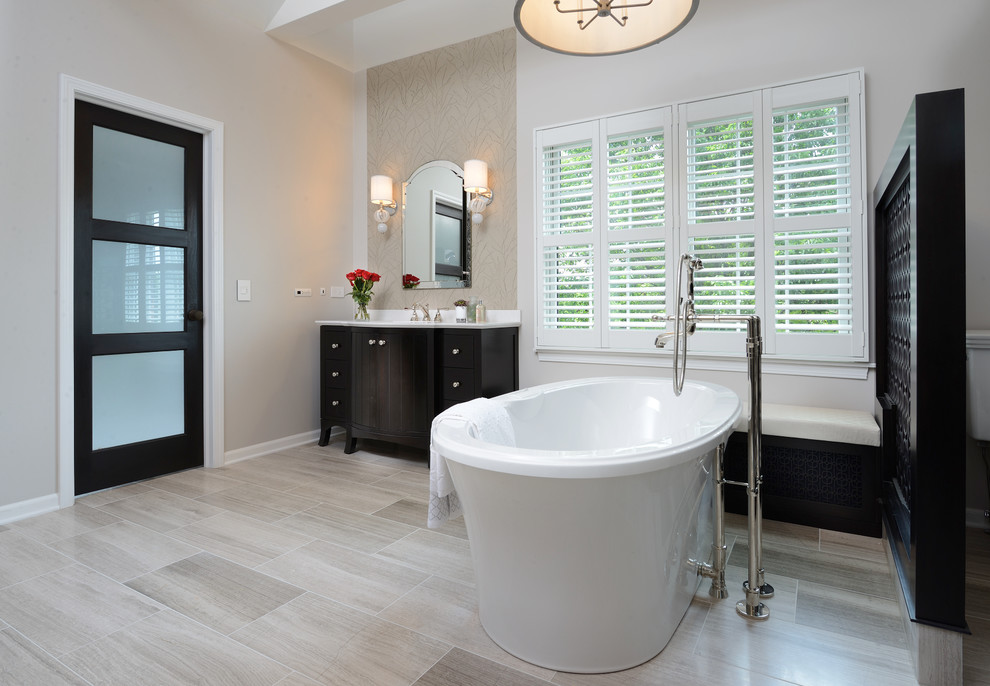 Inspiration for a transitional bathroom remodel with dark wood cabinets