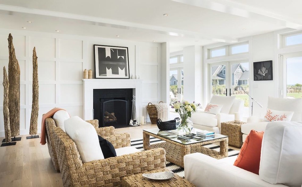 Inspiration for a large beach style formal open concept living room in Boston with white walls, light hardwood floors, a standard fireplace and a brick fireplace surround.