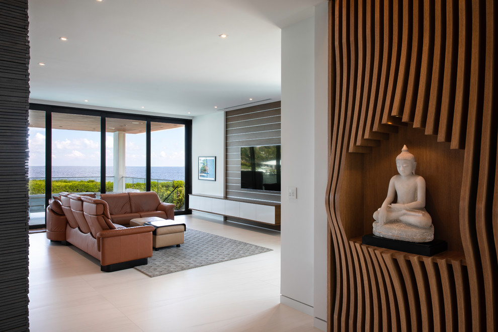 This is an example of a contemporary family room in Miami.