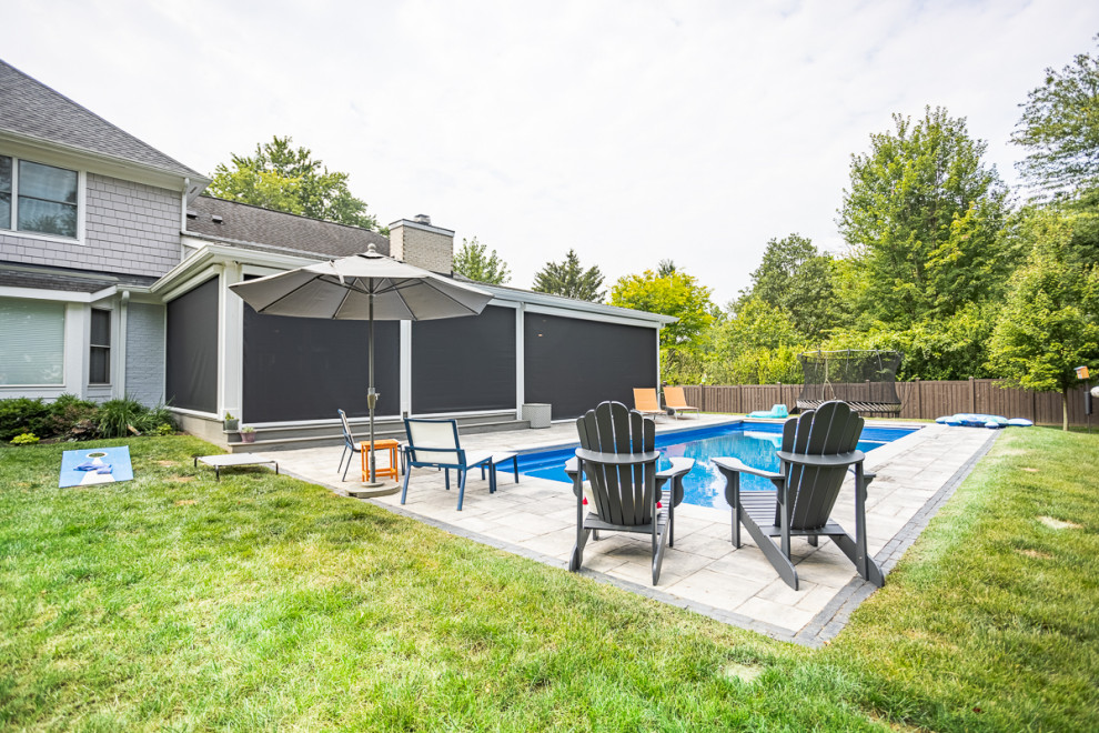 Example of a large transitional backyard rectangular lap pool design in Cincinnati