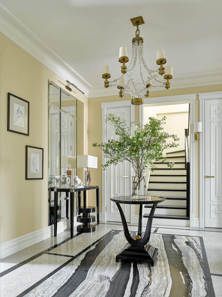 Design ideas for a large transitional foyer in Moscow with yellow walls, granite floors, a double front door and black floor.