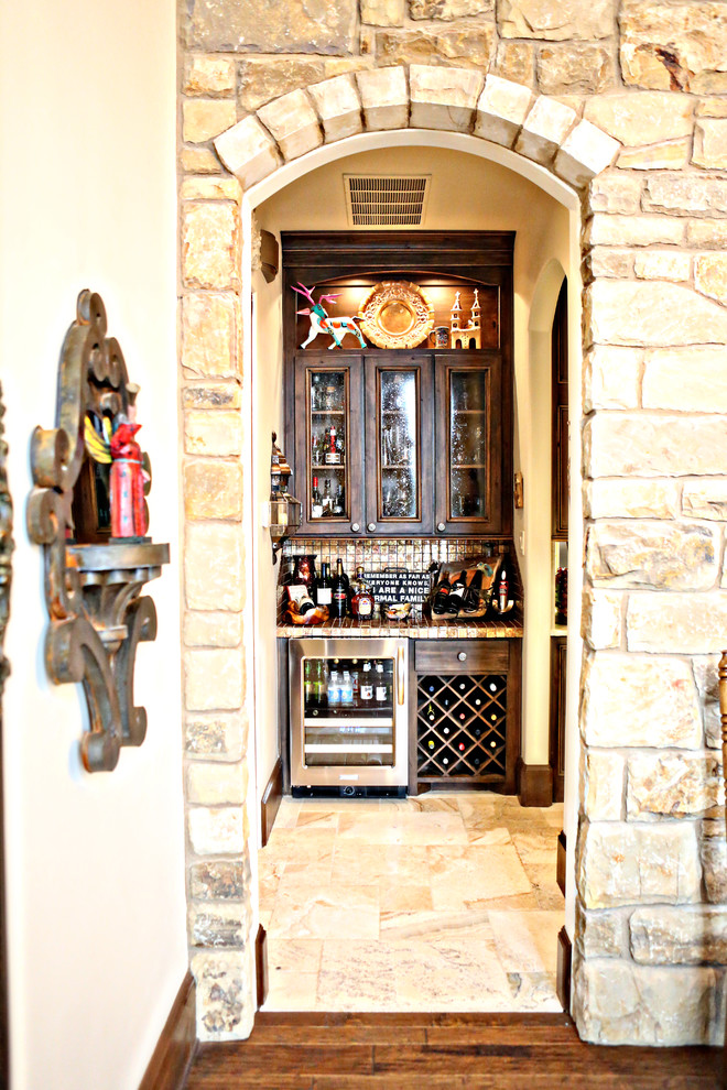 Mountain style wine cellar photo in Austin