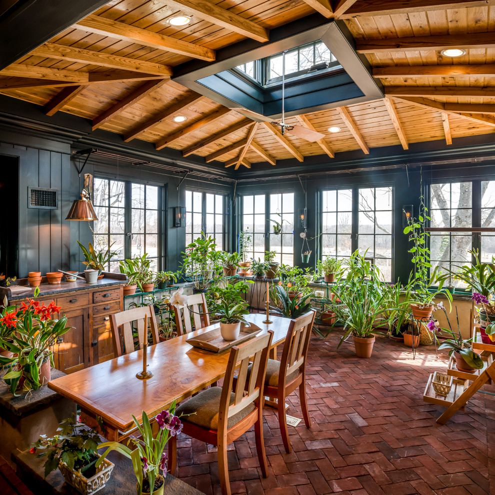 Photo of a mid-sized country sunroom in Philadelphia with brick floors, a skylight and red floor.