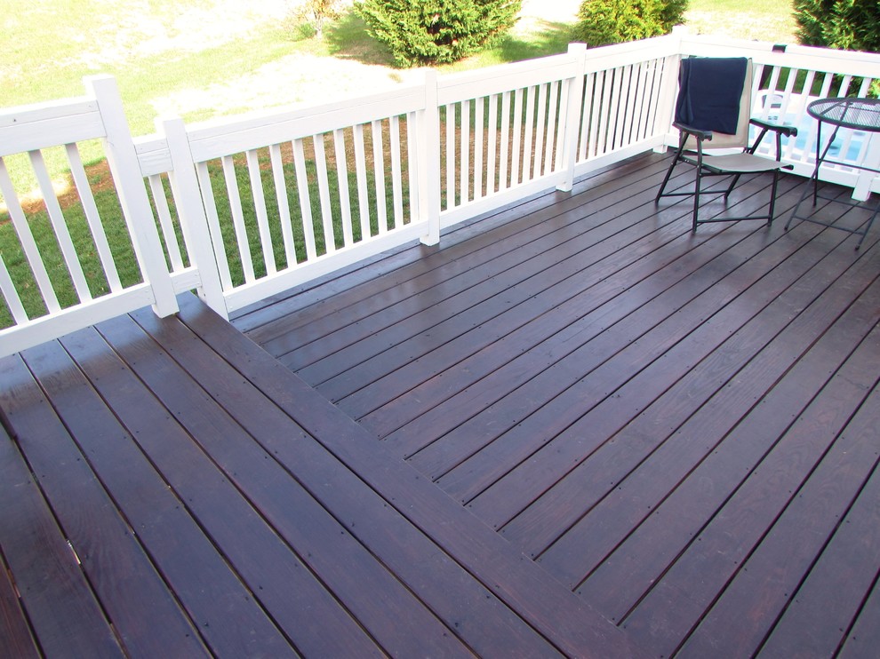 Inspiration for a large transitional backyard deck remodel with a fire pit and no cover