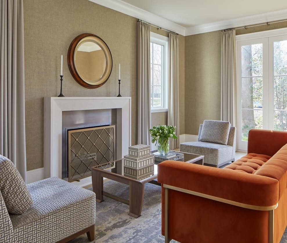 This is an example of a mid-sized contemporary formal enclosed living room in DC Metro with beige walls, a standard fireplace, a metal fireplace surround, no tv and brown floor.