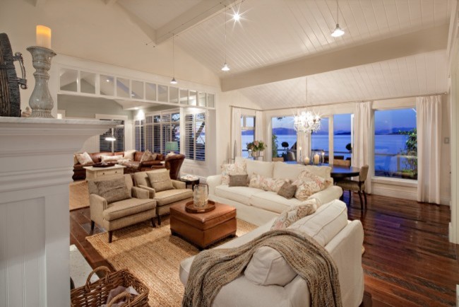 This is an example of an expansive beach style open concept living room in Vancouver.
