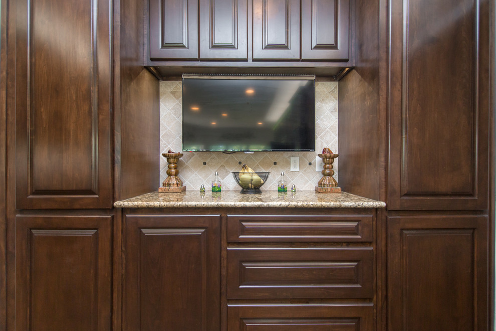 Inspiration for a kitchen remodel in Dallas with dark wood cabinets, granite countertops, beige backsplash, ceramic backsplash and an island
