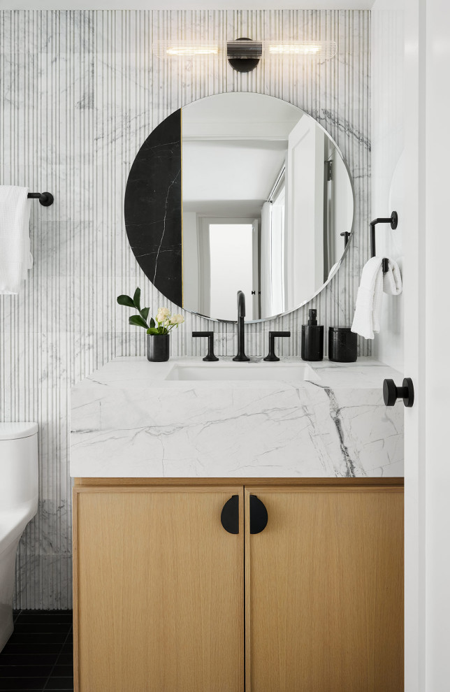 Bathroom - modern gray tile and marble tile single-sink bathroom idea in Chicago with flat-panel cabinets, light wood cabinets, quartz countertops, white countertops and a built-in vanity