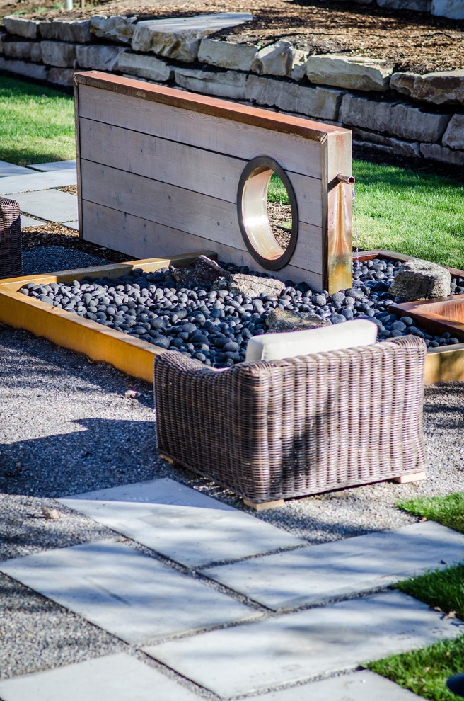 Inspiration for a large country backyard patio in Salt Lake City with a fire feature, gravel and no cover.