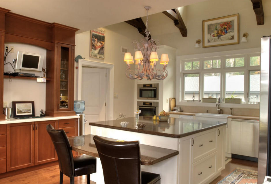 Example of a large mountain style galley dark wood floor open concept kitchen design in Boston with an undermount sink, shaker cabinets, white cabinets, granite countertops, stainless steel appliances and an island