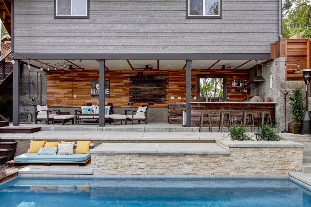 Design ideas for a beach style backyard patio in Sacramento with concrete slab.