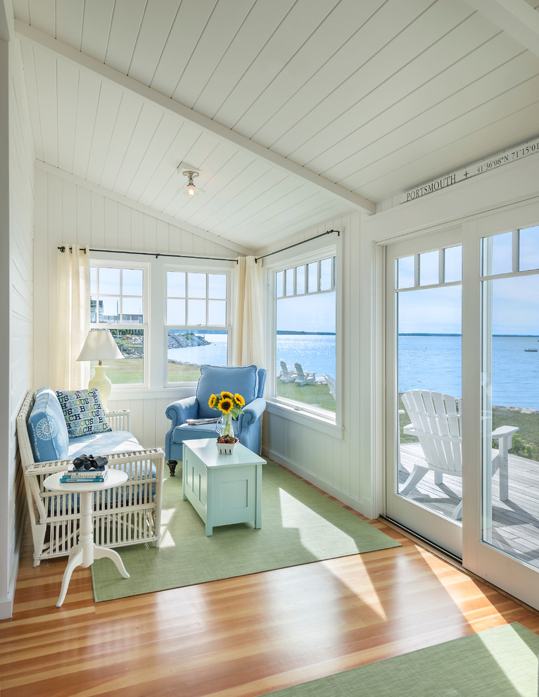 Design ideas for a beach style sunroom in Providence with medium hardwood floors, a standard ceiling and beige floor.