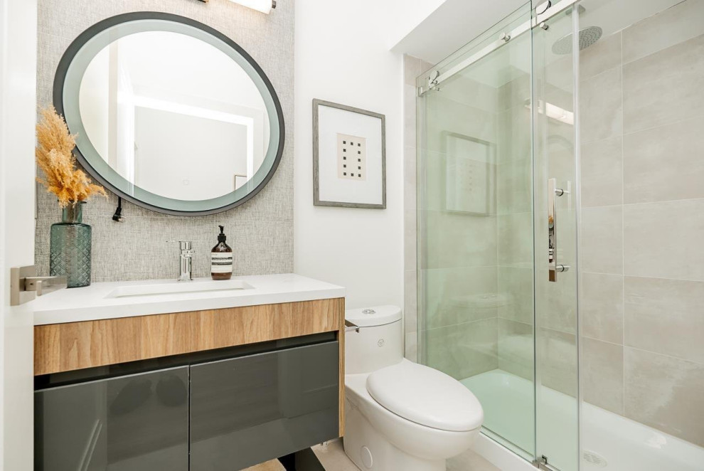 Alcove shower - mid-sized gray tile and ceramic tile ceramic tile, beige floor and single-sink alcove shower idea in Vancouver with flat-panel cabinets, gray cabinets, a one-piece toilet, white walls, quartzite countertops, white countertops and a floating vanity