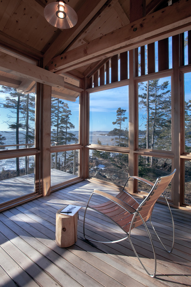 Inspiration for a country screened-in verandah in Portland Maine with decking and a roof extension.