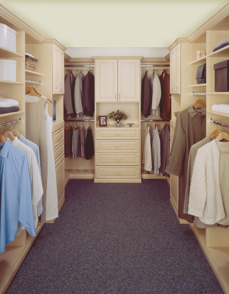 Photo of a mid-sized traditional gender-neutral walk-in wardrobe in Orange County with flat-panel cabinets and white cabinets.