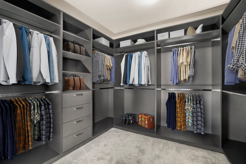 Photo of a modern gender-neutral walk-in wardrobe in Melbourne with open cabinets, grey cabinets, carpet, grey floor and recessed.