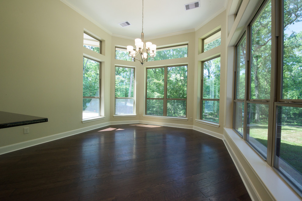 This is an example of a mid-sized traditional open plan dining in Houston with beige walls, dark hardwood floors and no fireplace.