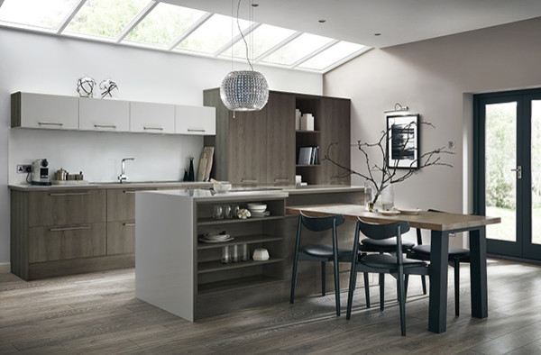 This is an example of a mid-sized contemporary single-wall kitchen in Other with an integrated sink, flat-panel cabinets, grey cabinets, white splashback, panelled appliances and with island.