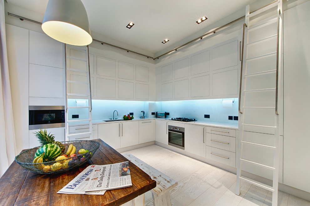 Design ideas for a mid-sized contemporary kitchen in Surrey.