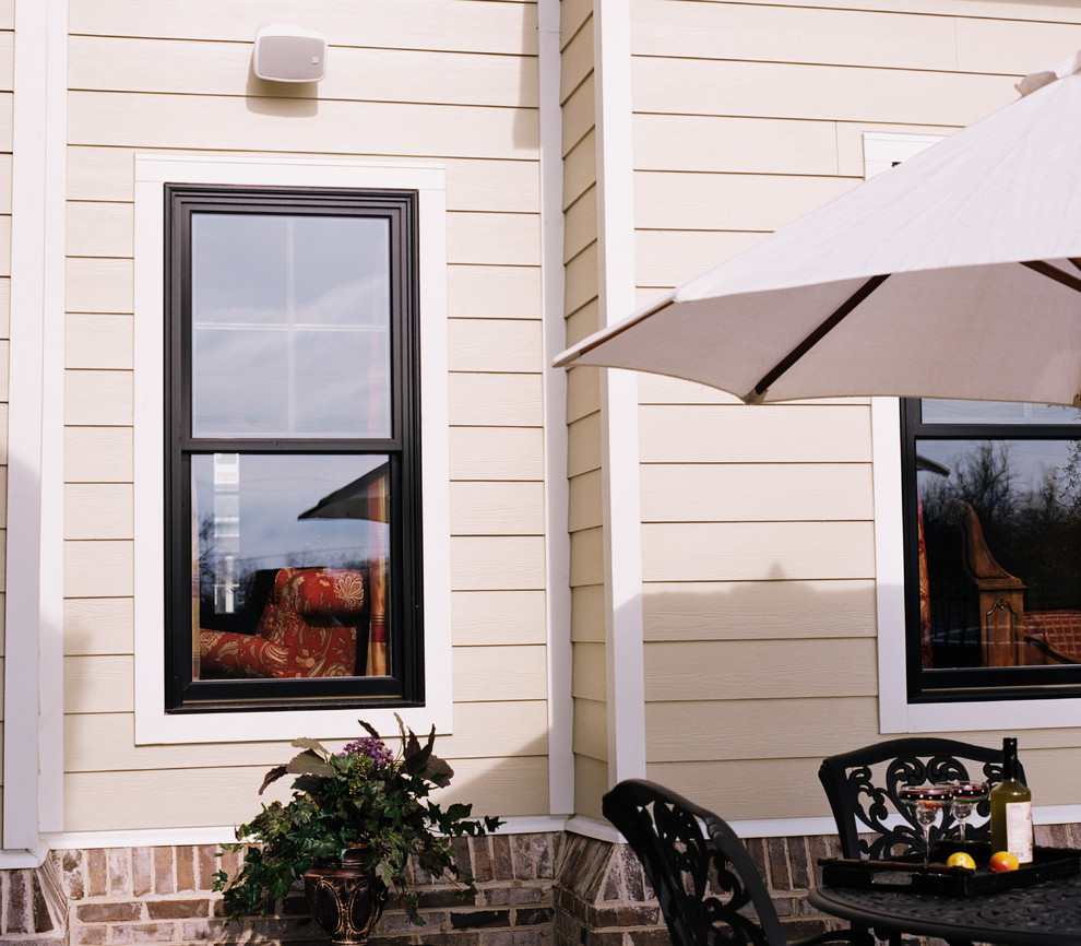 Transitional beige wood exterior home photo in Chicago