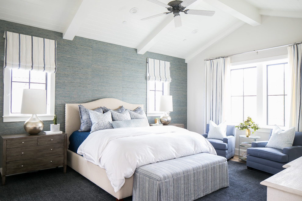 This is an example of a beach style bedroom in Los Angeles with white walls.