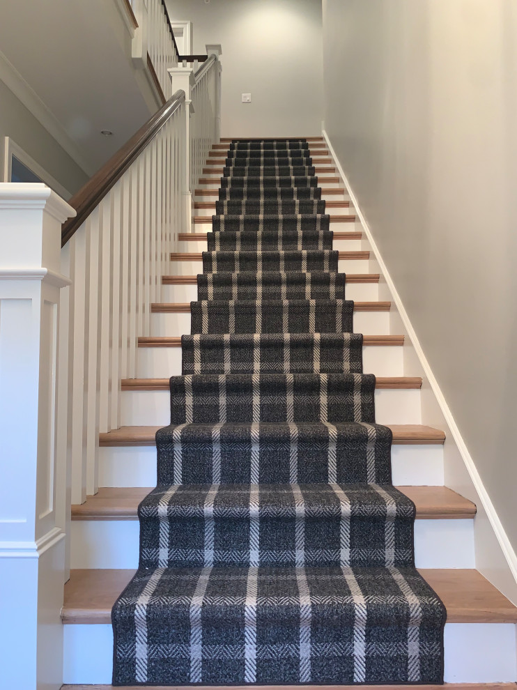 Design ideas for a small classic carpeted straight wood railing staircase in Chicago with carpeted risers.