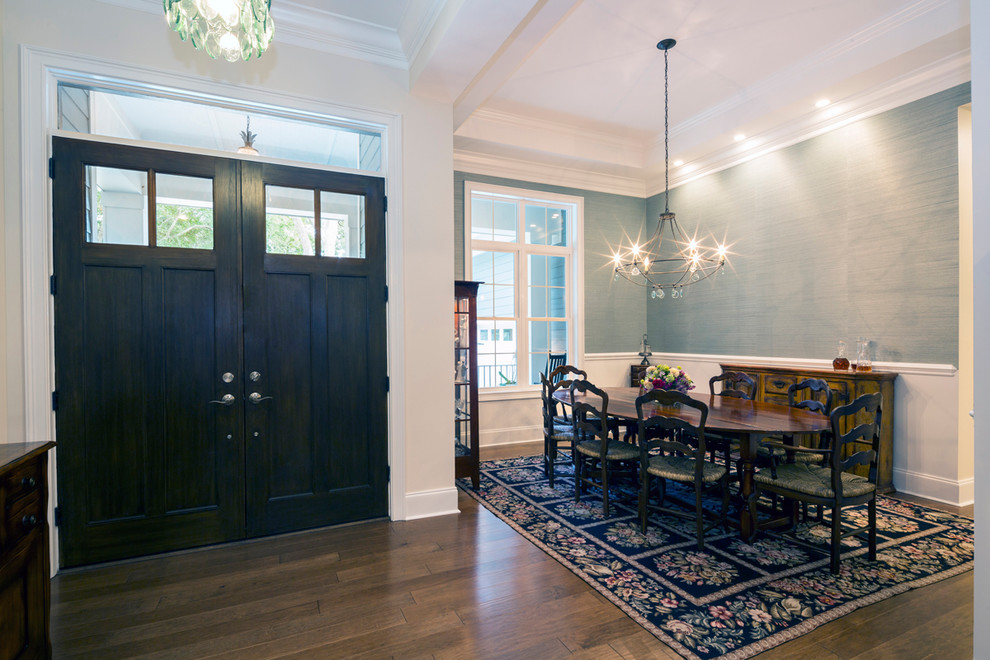 Photo of a mid-sized transitional open plan dining in Orange County with blue walls, dark hardwood floors and brown floor.