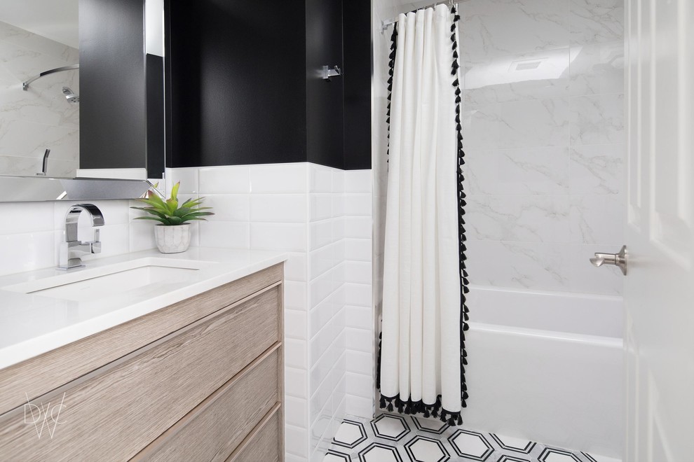 Design ideas for a mid-sized transitional master bathroom in Chicago with flat-panel cabinets, grey cabinets, an alcove tub, a shower/bathtub combo, a one-piece toilet, beige tile, ceramic tile, black walls, mosaic tile floors, an undermount sink, marble benchtops, multi-coloured floor and an open shower.