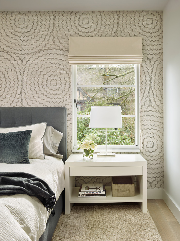 Inspiration for a transitional master light wood floor bedroom remodel in Seattle with white walls