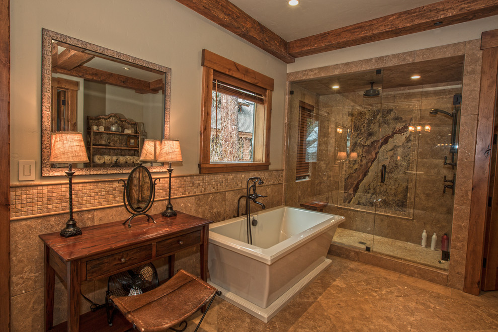 Mountain style master beige floor freestanding bathtub photo with furniture-like cabinets, dark wood cabinets and a hinged shower door
