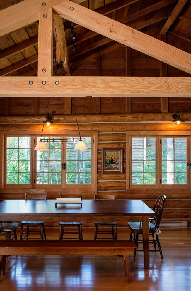 Dining room - large rustic medium tone wood floor dining room idea
