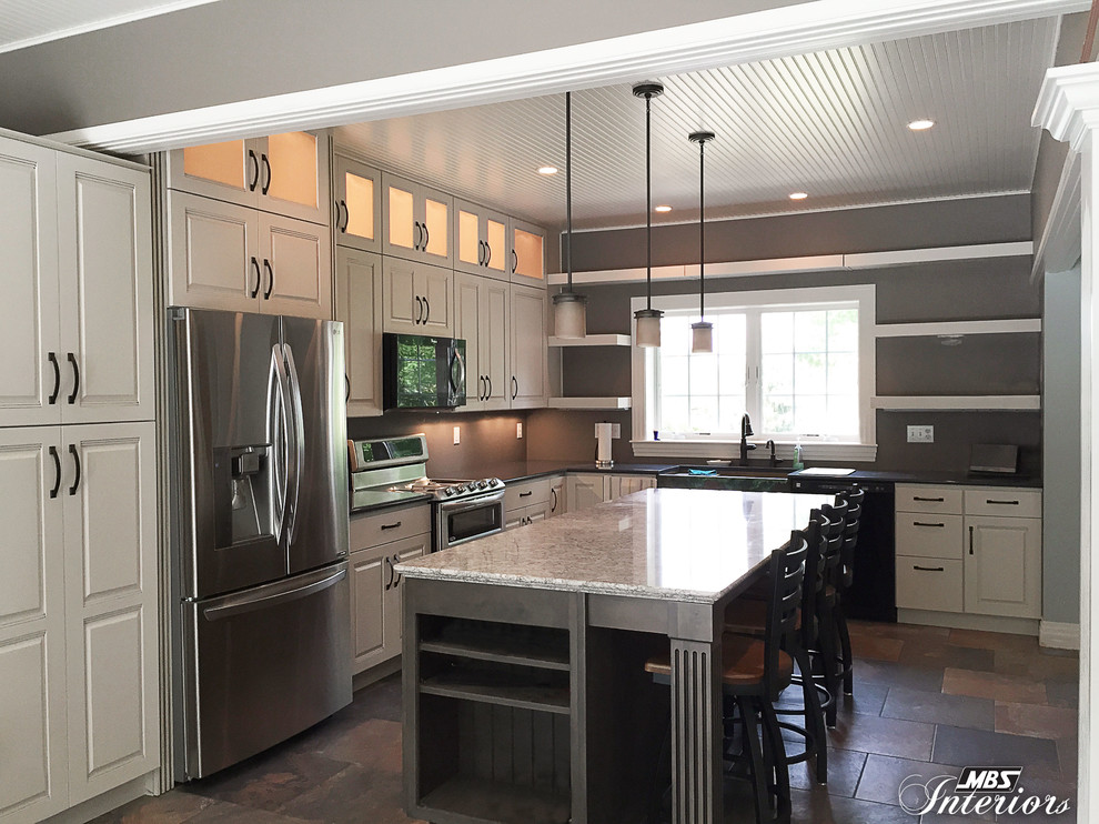 Kitchen - transitional l-shaped kitchen idea with a farmhouse sink, white cabinets, quartz countertops, stainless steel appliances and an island