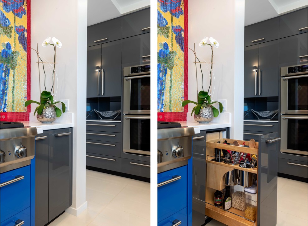 This is an example of a large modern u-shaped eat-in kitchen in Hawaii with flat-panel cabinets, grey cabinets, solid surface benchtops, multi-coloured splashback, mosaic tile splashback, panelled appliances, with island, white floor and white benchtop.