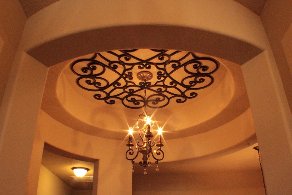 This is an example of a traditional entryway in Houston with white walls.
