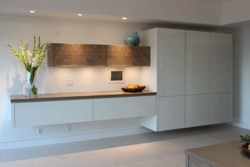 Large contemporary kitchen in San Francisco with an undermount sink, white cabinets, quartz benchtops, brown splashback, stone slab splashback, panelled appliances, ceramic floors and with island.