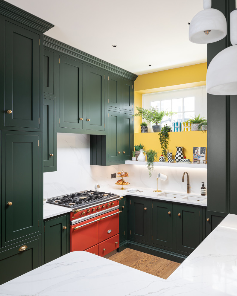 Inspiration for a small eclectic u-shaped kitchen remodel in London with shaker cabinets, green cabinets, quartzite countertops, white backsplash and white countertops