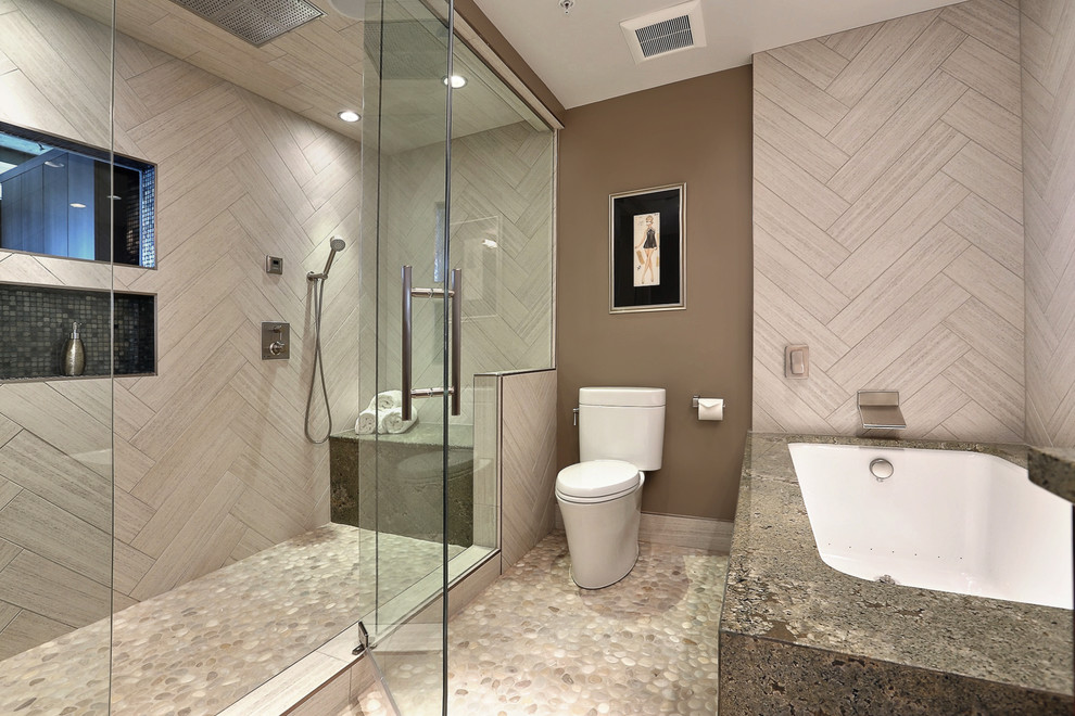 Inspiration for a large contemporary master bathroom in Denver with an undermount sink, flat-panel cabinets, medium wood cabinets, granite benchtops, an undermount tub, a two-piece toilet, white tile, porcelain tile, brown walls and an alcove shower.