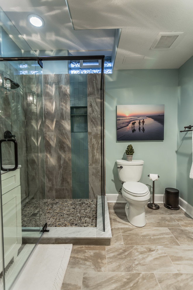 Design ideas for a mid-sized tropical bathroom in Cleveland with travertine floors.