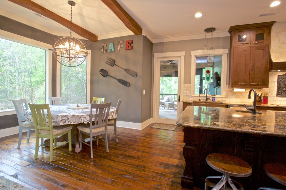 Example of a mid-sized transitional medium tone wood floor kitchen/dining room combo design with gray walls and no fireplace
